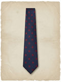 Corbata estampada marino con escudo burdeos