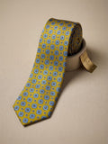 Corbata amarilla con estampado de mosaico azul