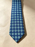 Corbata azul con mosaico de círculos celeste