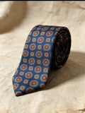 Corbata azul con detalle mosaico en rojo